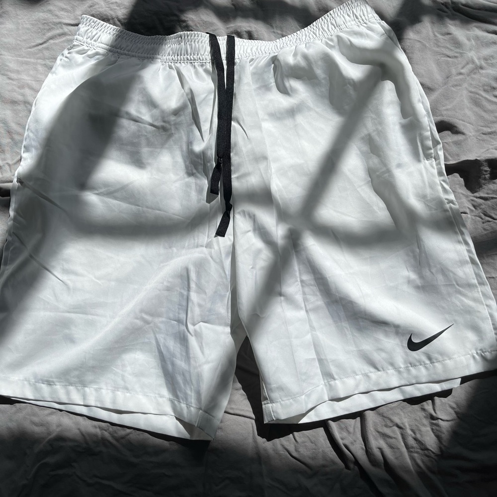 2 pairs of nike running shorts